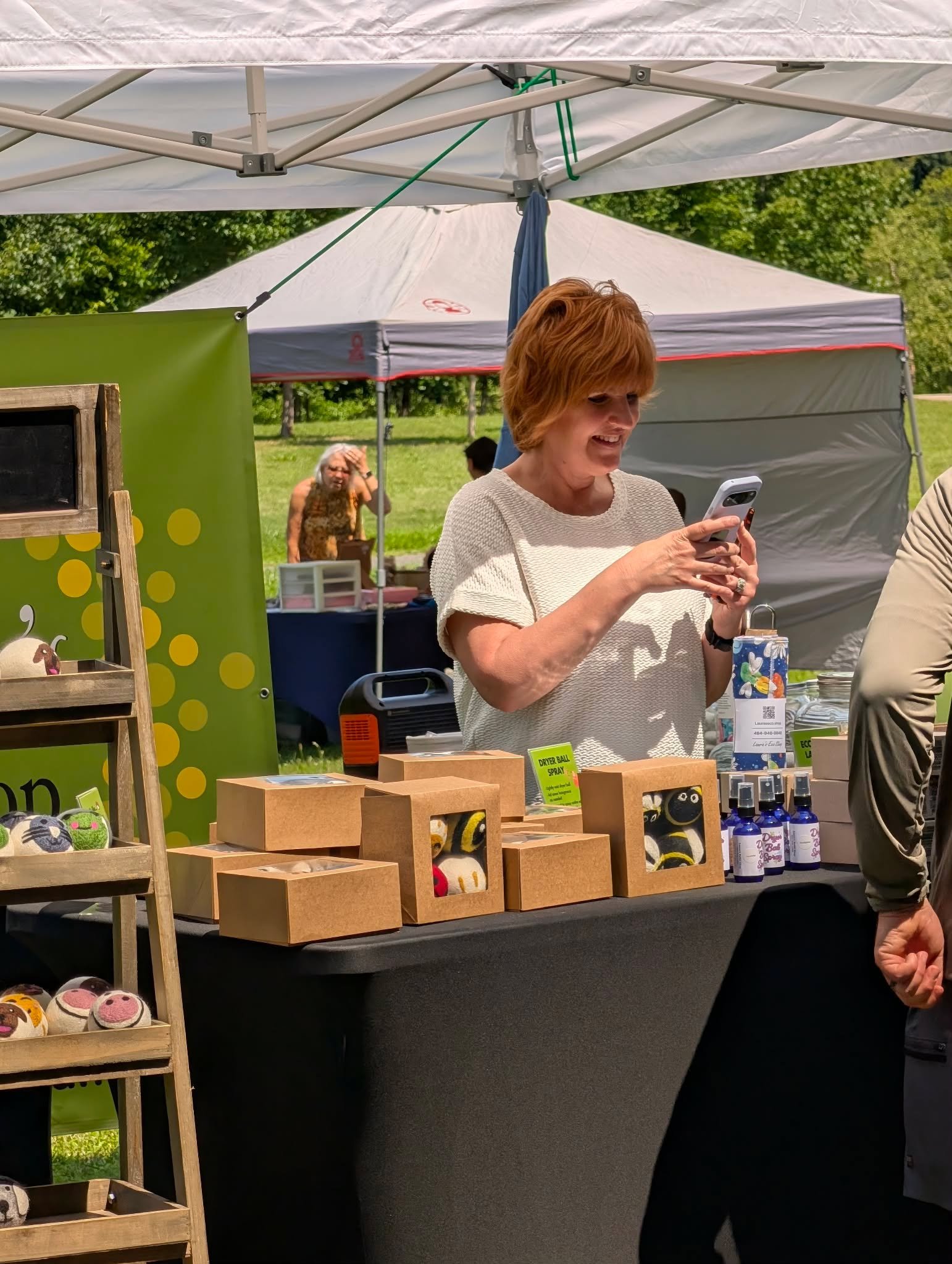 Laura's Eco Shop reusable products displayed at a community event