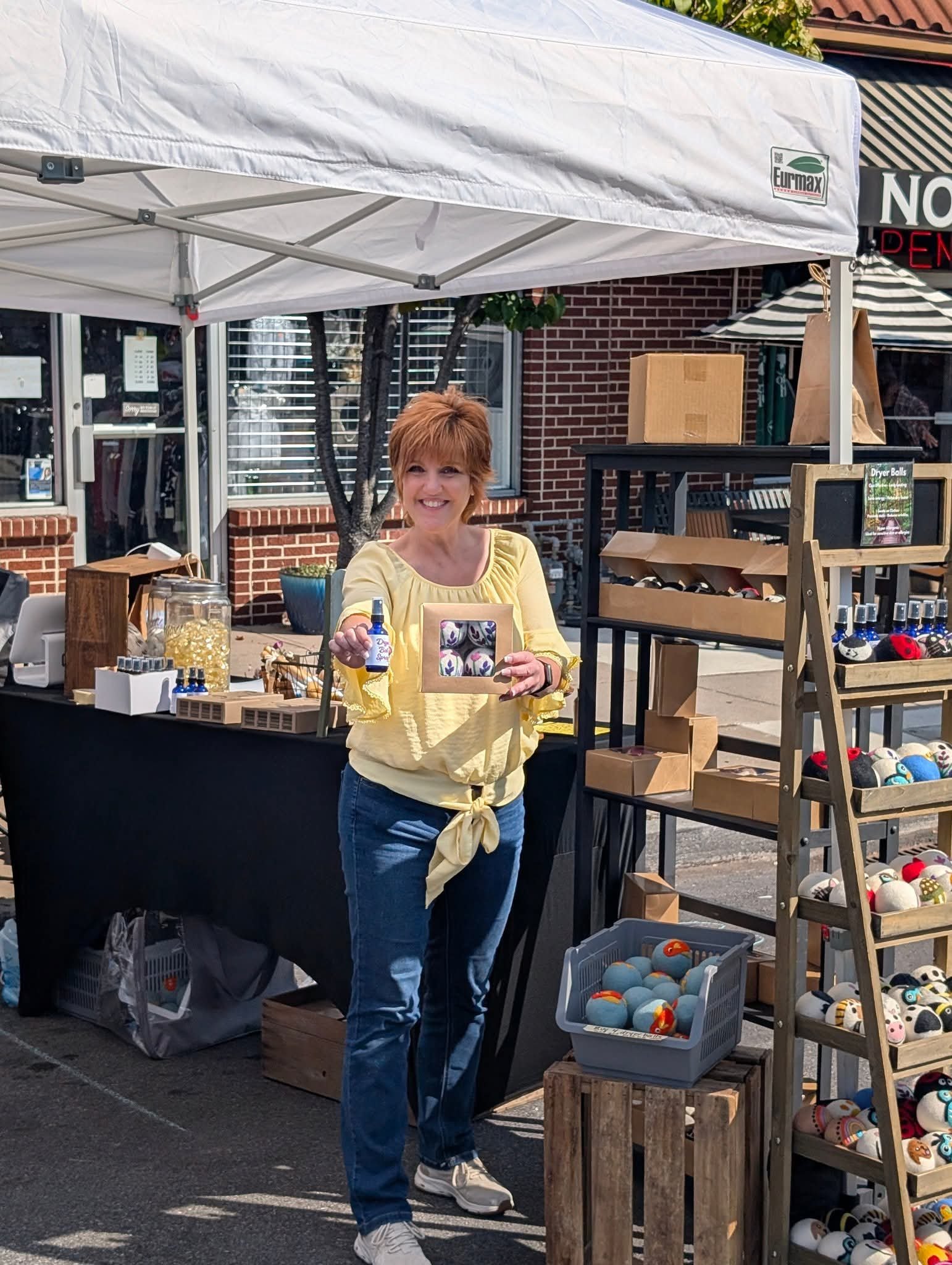 Laura with reusable paperless towels and carefully curated wool dryer balls